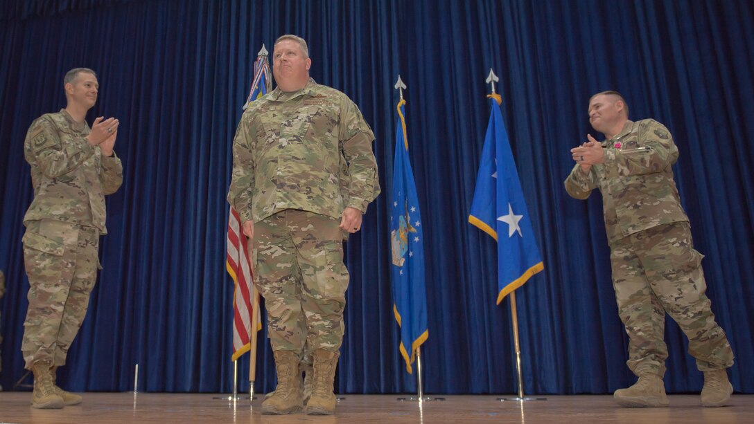 U.S. Air Force Col. Rodney Simpson receives applause after assuming command of the 386th Air Expeditionary Wing at Ali Al Salem Air Base, Kuwait, July 11, 2019. Simpson was previously assigned to Air Mobility Command, Scott Air Force Base, Ill. (U.S. Air Force photo by Tech. Sgt. Daniel Martinez)