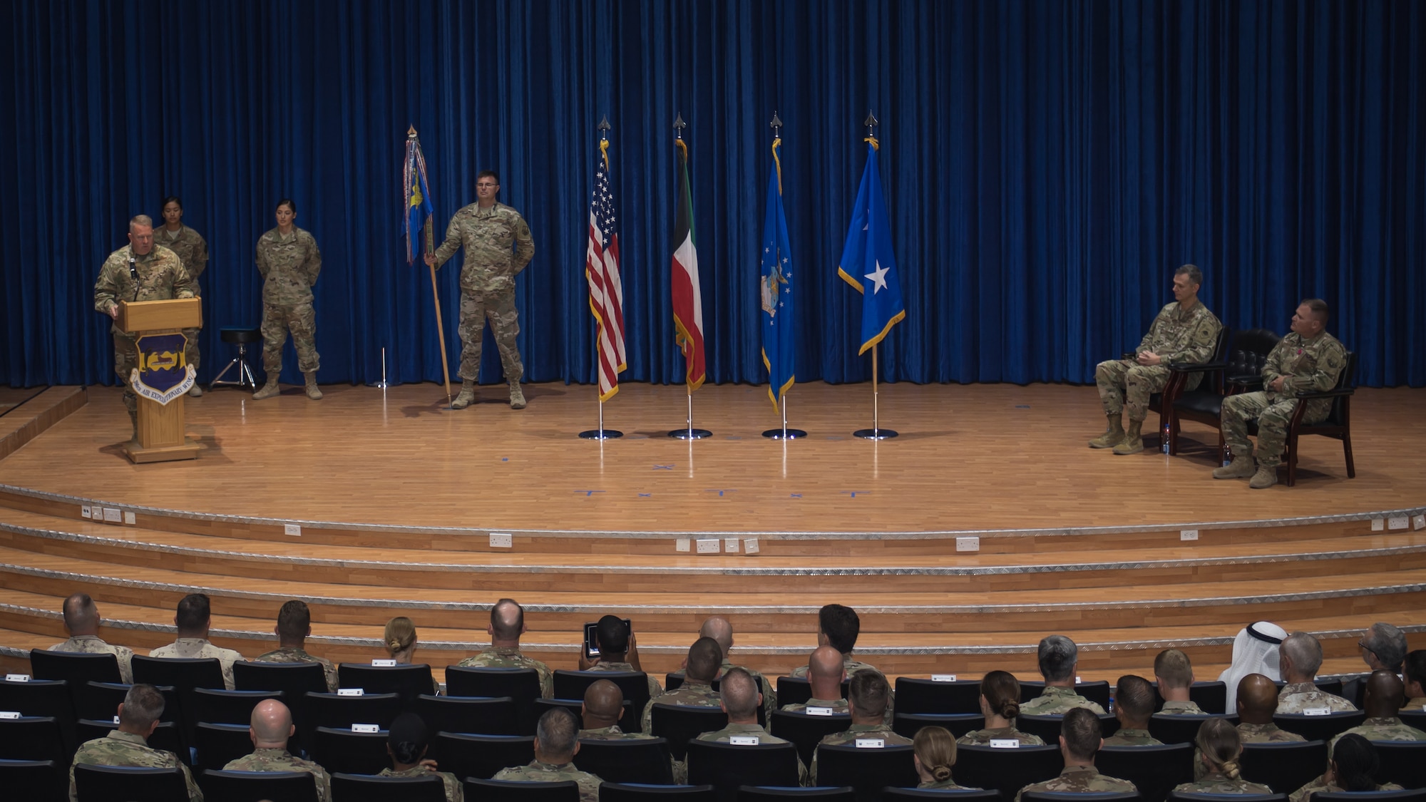 U.S. Air Force Col. Rodney Simpson addresses the audience after assuming command of the 386th Air Expeditionary Wing at Ali Al Salem Air Base, Kuwait, July 11, 2019. Simpson was previously assigned to Air Mobility Command, Scott Air Force Base, Ill. (U.S. Air Force photo by Tech. Sgt. Daniel Martinez)
