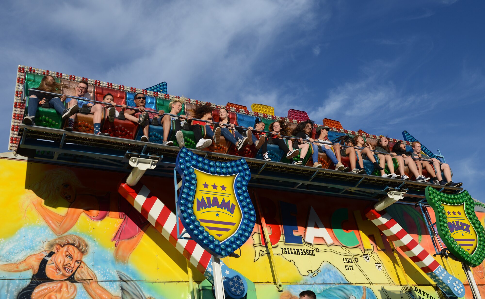 Members of the Kaiserslautern Military Community smile as they ride “Miami” during Freedom Fest on Ramstein Air Base, Germany, July 4, 2019.