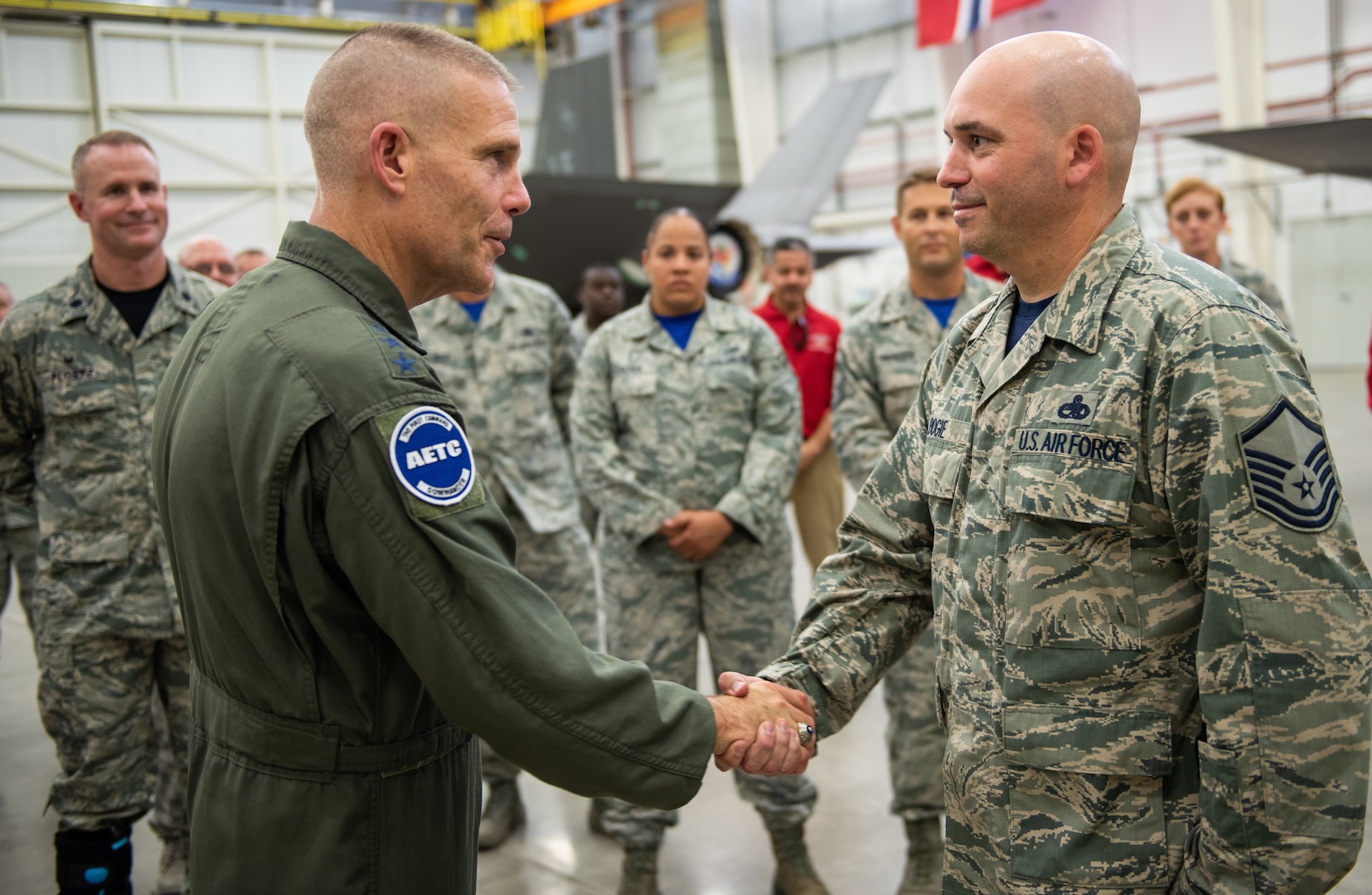 U.S. Air Force Lt. Gen. Steven Kwast, commander of Air Education and Training Command, meets with an Airman assigned to the 56th Fighter Wing at Luke Air Force Base, Arizona, during a visit July 20, 2018. Kwast, a U.S. Air Force Academy graduate, will pass command of AETC to Lt. Gen. Brad Webb July 26, 2019.