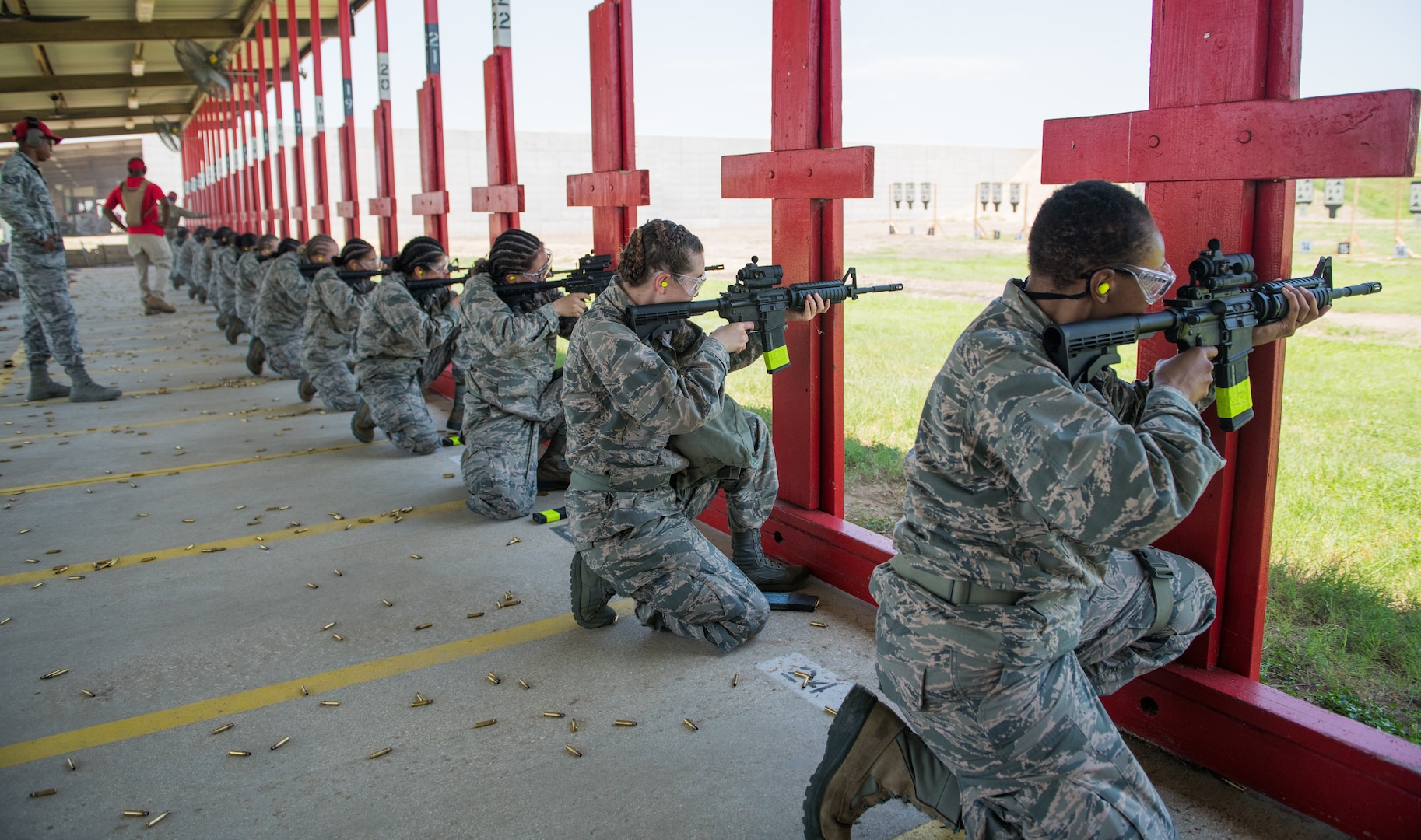 Air Force Basic Military Training trainees fire their M-4 Carbine during a weapons familiarization course June 8 at Joint Base San Antonio-Medina Annex. The firing range allows instructors to train 244 BMT trainees daily, four days a week, qualifying more than 40,000 BMT trainees in the M-4 carbine annually.