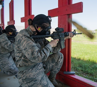 Air Force Basic Military Training trainees fire their M-4 Carbine during a weapons familiarization course June 8 at Joint Base San Antonio-Medina Annex. The firing range allows instructors to train 244 BMT trainees daily, four days a week, qualifying more than 40,000 BMT trainees in the M-4 carbine annually.