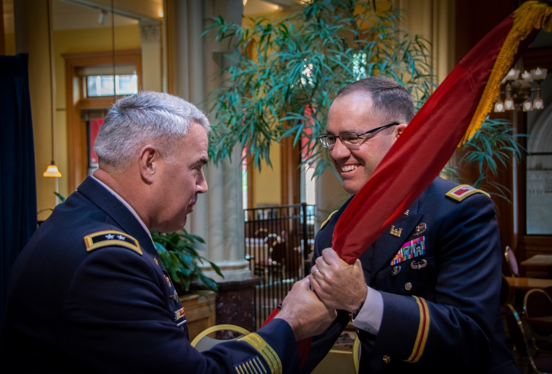 two army officers conduct a change of command ceremony