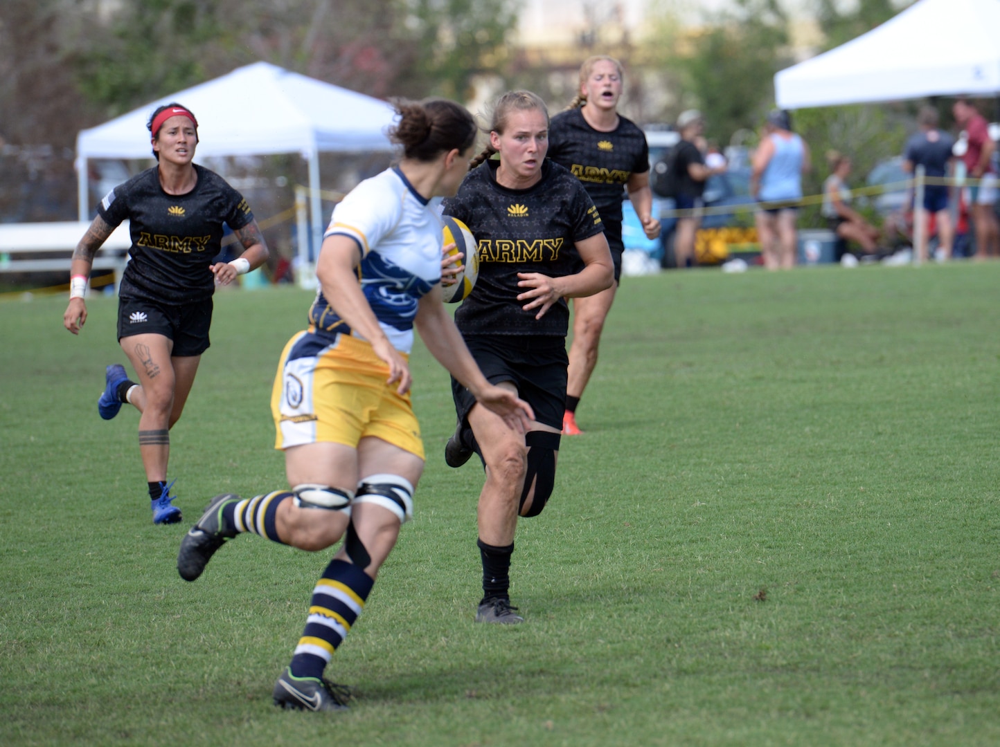 WILMINGTON, N.C. (June 6, 2019) -- Army faces off against Navy on day two of the inaugural Armed Forces Women's Rugby Championship held in Wilmington, N.C. July 5-7, 2019. This historic event features the best female rugby players from the Army, Marine Corps, Navy, Air Force, and Coast Guard, who will compete for the title of the first ever Women's Rugby Champs (U.S. Dept. of Defense photo by Chief Mass Communication Specialist Patrick Gordon/RELEASED)