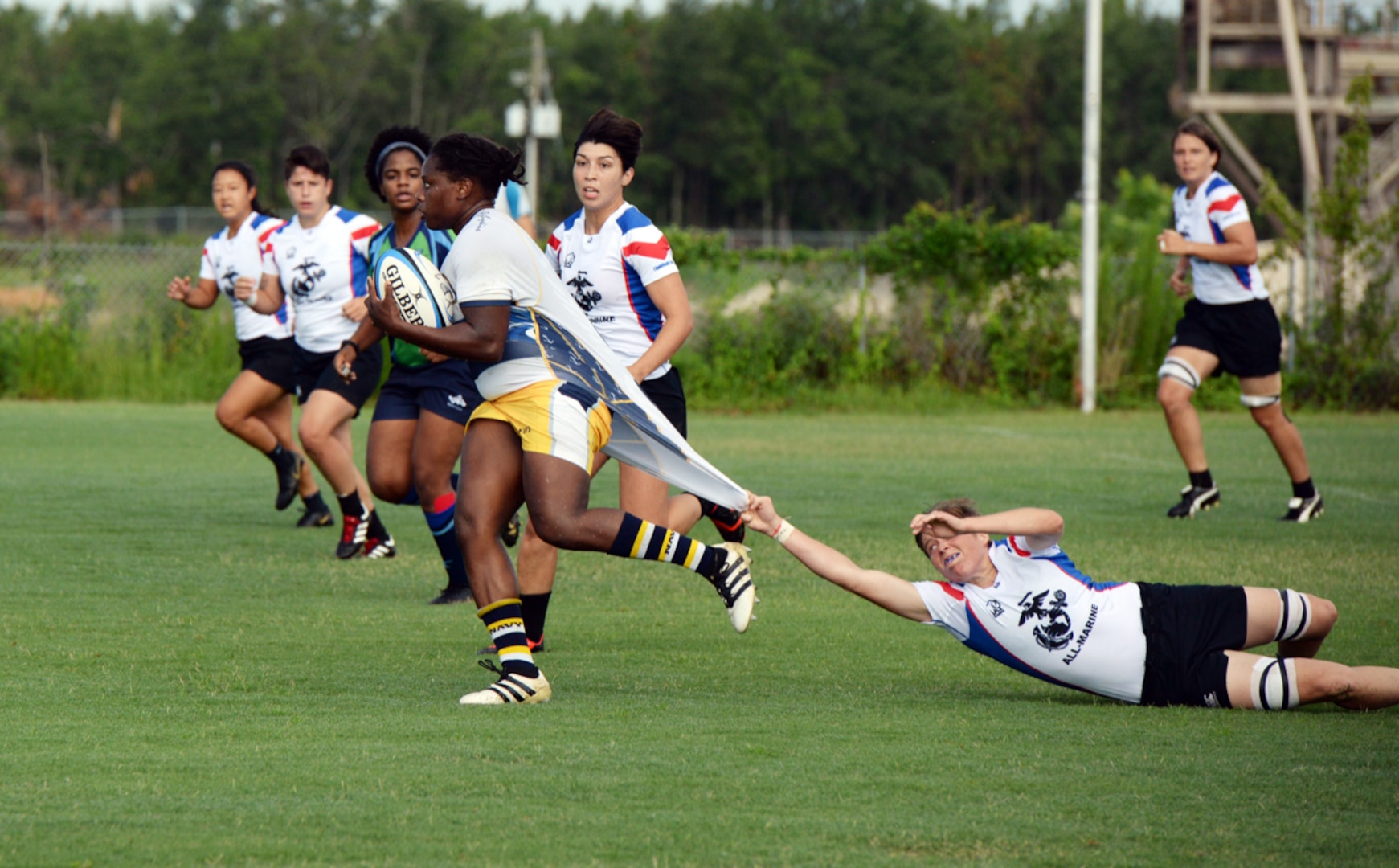 WILMINGTON, N.C. (June 6, 2019) -- Navy faces off against Marine Corps on day two of the inaugural Armed Forces Women's Rugby Championship held in Wilmington, N.C. July 5-7, 2019. This historic event features the best female rugby players from the Army, Marine Corps, Navy, Air Force, and Coast Guard, who will compete for the title of the first ever Women's Rugby Champs (U.S. Dept. of Defense photo by Chief Mass Communication Specialist Patrick Gordon/RELEASED)
