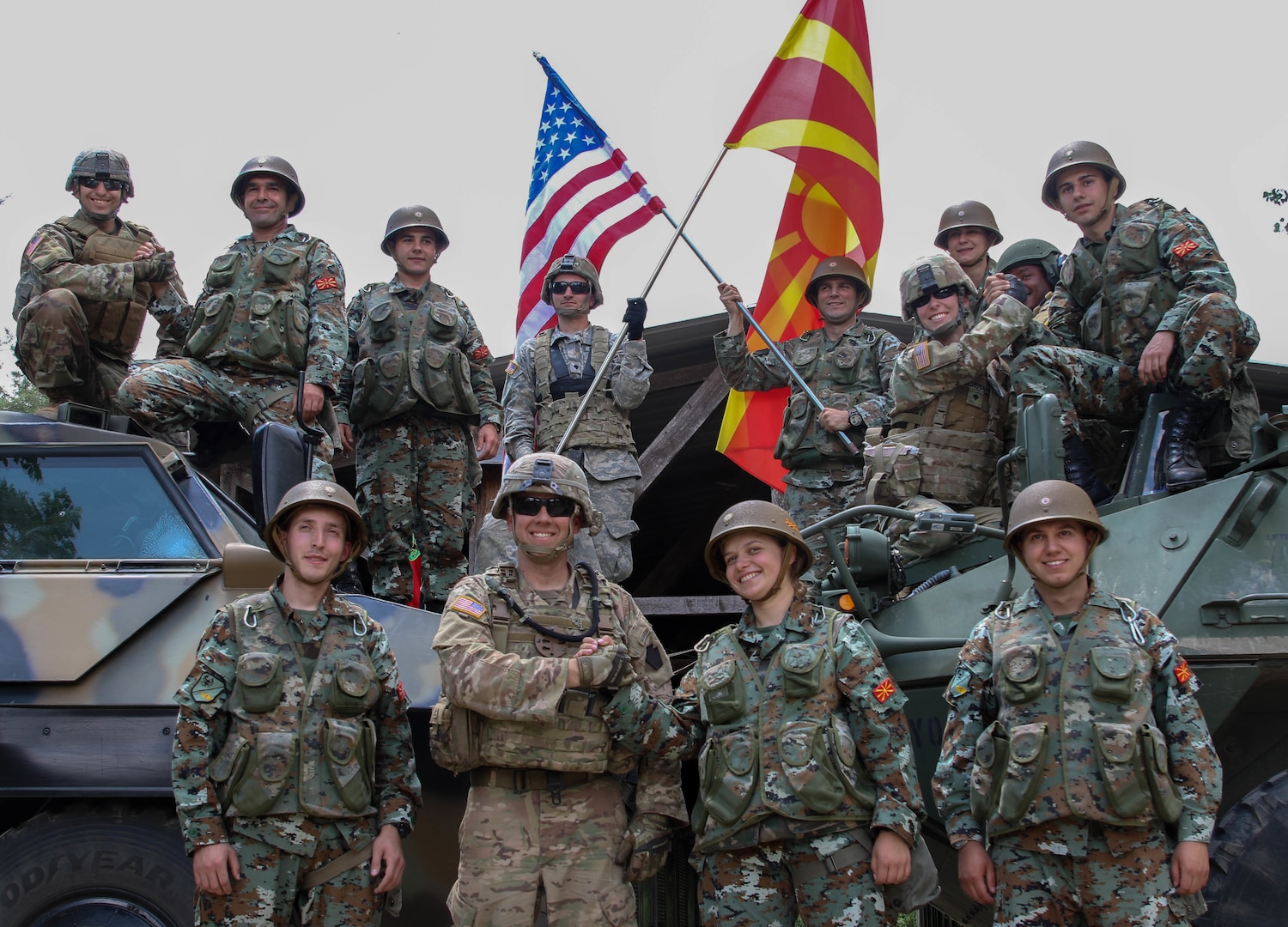 American Soldiers from the 56th Stryker Brigade Combat Team, Pennsylvania Army National Guard, and soldiers from the Republic of North Macedonia by their tactical vehicles to show unity between the two nations, following the Exercise Decisive Strike’s opening ceremony at the Training Support Centre Krivolak , North Macedonia, June 5, 2019.