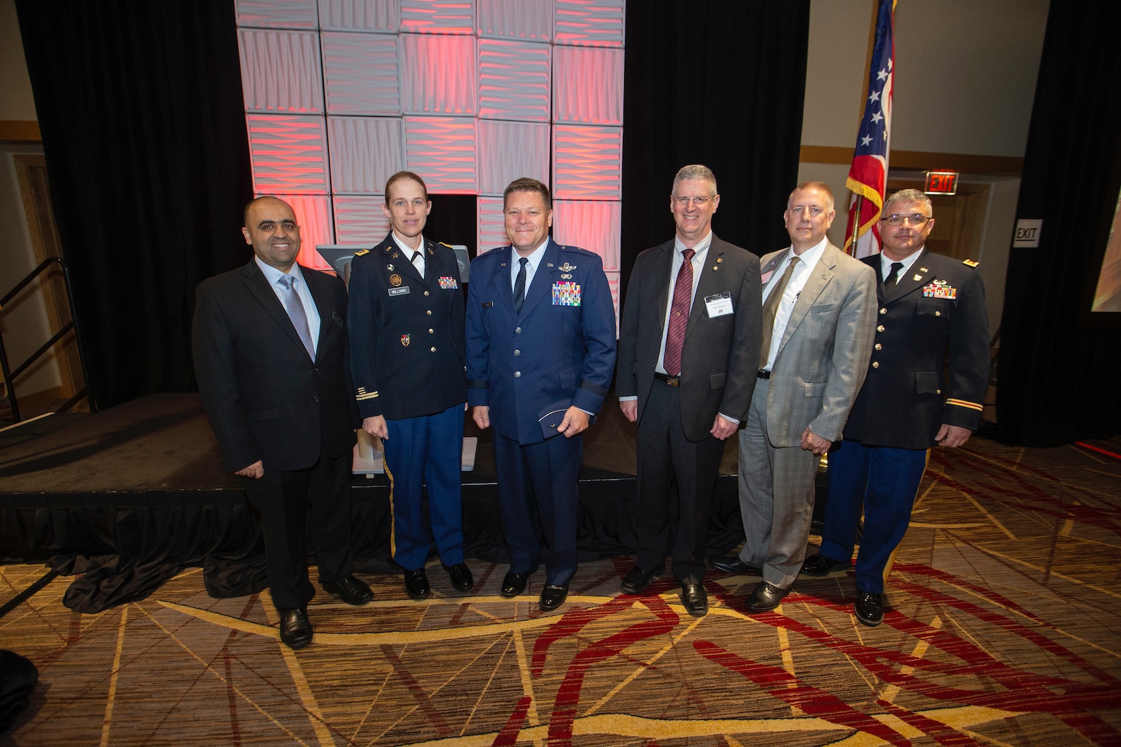 Representatives from the Ohio Adjutant General’s Department and the University of Cincinnati stand for a photo June 19, 2019, during the university’s Cybersecurity Education Symposium to celebrate the completion of the second phase of the rollout of the Ohio Cyber Range. The next phase of the OCR rollout will see the power of the computing system at UC doubled and an identical system installed at the University of Akron.