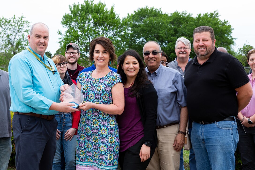 NNSY's NCMA President Bill Welch presents Kim Zaner her Administrative Assistant of the Year Award.
