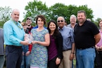 NNSY's NCMA President Bill Welch presents Kim Zaner her Administrative Assistant of the Year Award.