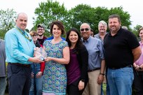 NNSY's NCMA President Bill Welch presents Kim Zaner her Administrative Assistant of the Year Award.