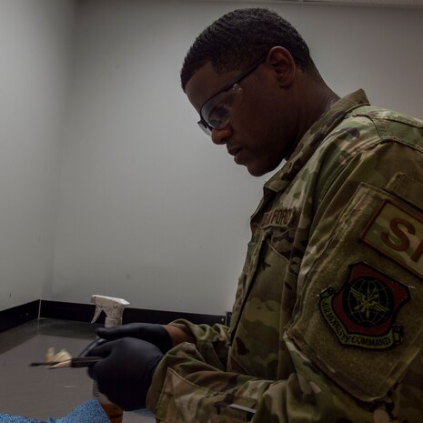 Staff Sgt. Rossitor Alexander, an instructor assigned to the 628th Security Forces Squadron Combat Arms Training and Maintenance flight, cleans an M9 pistol at Joint Base Charleston, S.C. July 1, 2019. CATM facilitates readiness by equipping Airmen with the knowledge and skills to use weapons properly, and provides support to local and regional military branches. CATM instructors qualify for the weapons annually to maintain proficiency.