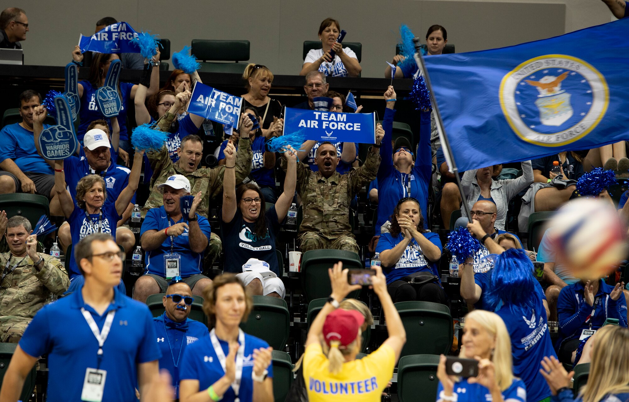 Crowd members cheer on Team Air Force during a sitting volleyball competition, June 30, 2019, in Tampa, Florida. Team Air Force competed against Team Navy in the gold medal match. (U.S. Air Force photo by Staff Sgt. Sahara L. Fales)