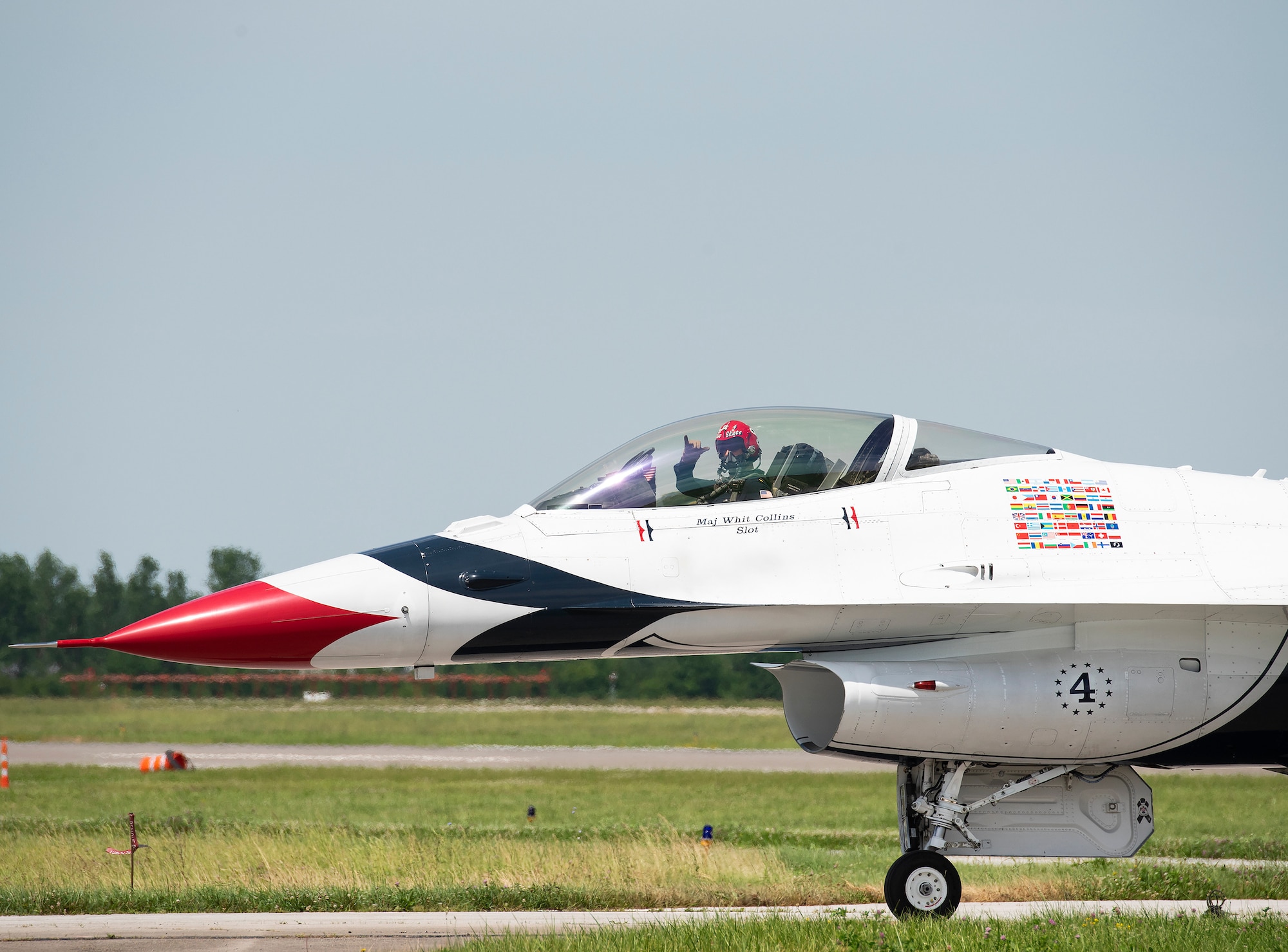 Maj. Whit Collins, Thunderbird No. 4, taxi's his F-16D during the Dayton-Vectren Airshow June 22, 2019. From their G-suits to the custom earpieces worn by the pilots to the F-16’s transparent bubble canopy, the fly-by-wire flight controls and the pilot/vehicle interface, AFRL technologies accompany the Thunderbirds around the world as they perform in airshows.(U.S. Air Force photo/Rich Oriez)