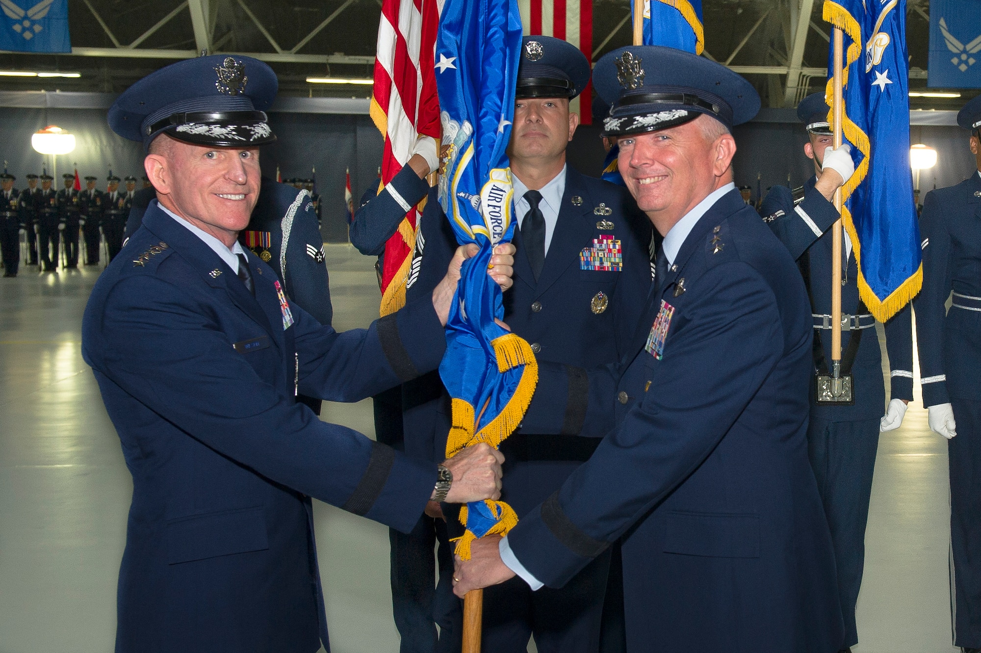 Maj. Gen. Ricky N. Rupp, right, assumes command of the Air Force District of Washington from Air Force Vice Chief of Staff Gen. Stephen Wilson during the AFDW Change of Command Ceremony at Joint Base Andrews, Md., July 9, 2019. Wilson presided over the ceremony where Maj. Gen. James A. Jacobson relinquished command. (U.S. Air Force photo by Master Sgt. Michael B. Keller)