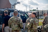 190711-N-OE749-0010 JOINT BASE LANGLEY-EUSTIS, Va. (July 11, 2019) Dequinn McGraw, a telecommunication specialist assigned to Joint Task Force Civil Support, gives a tour of an emergency response vehicle and other communication equipment as part of the annual JTF-CS Defense Chemical, Biological, Radiological, Nuclear Response Force (DCRF) Communications Workshop. The two-day course is geared toward enhancing DCRF operations by providing vital training and face-to-face interaction between current and follow-on DCRF units. (U.S. Navy photo by Chief Mass Communication Specialist Barry A. Riley/RELEASED)