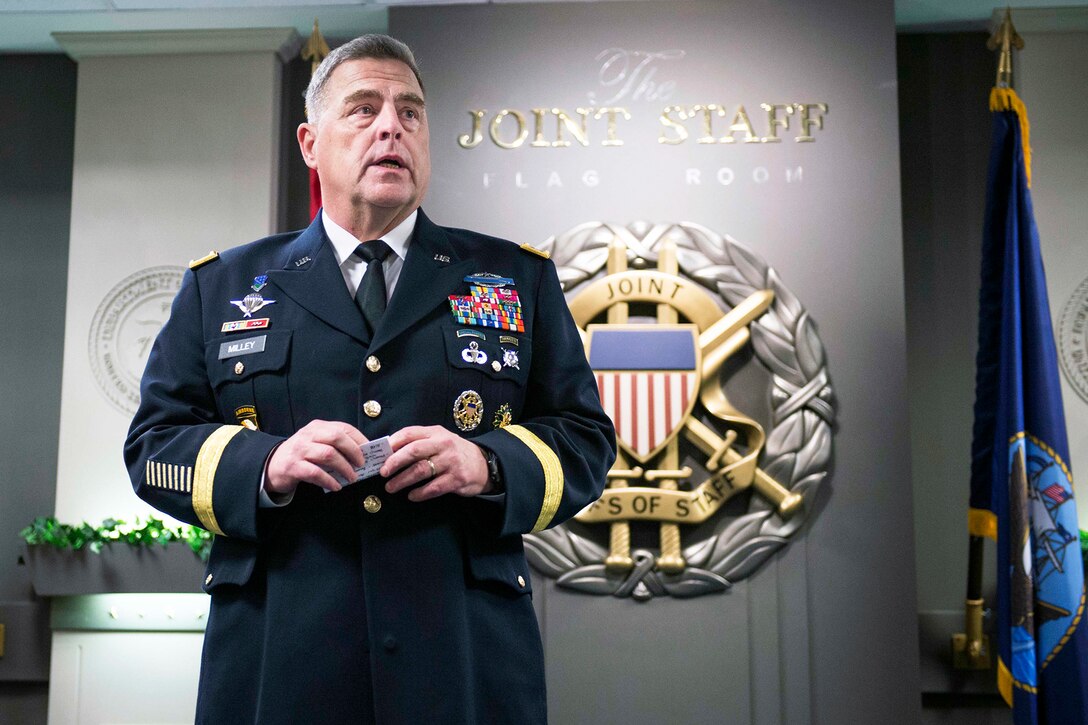 An Army officer speaks  during a ceremony.