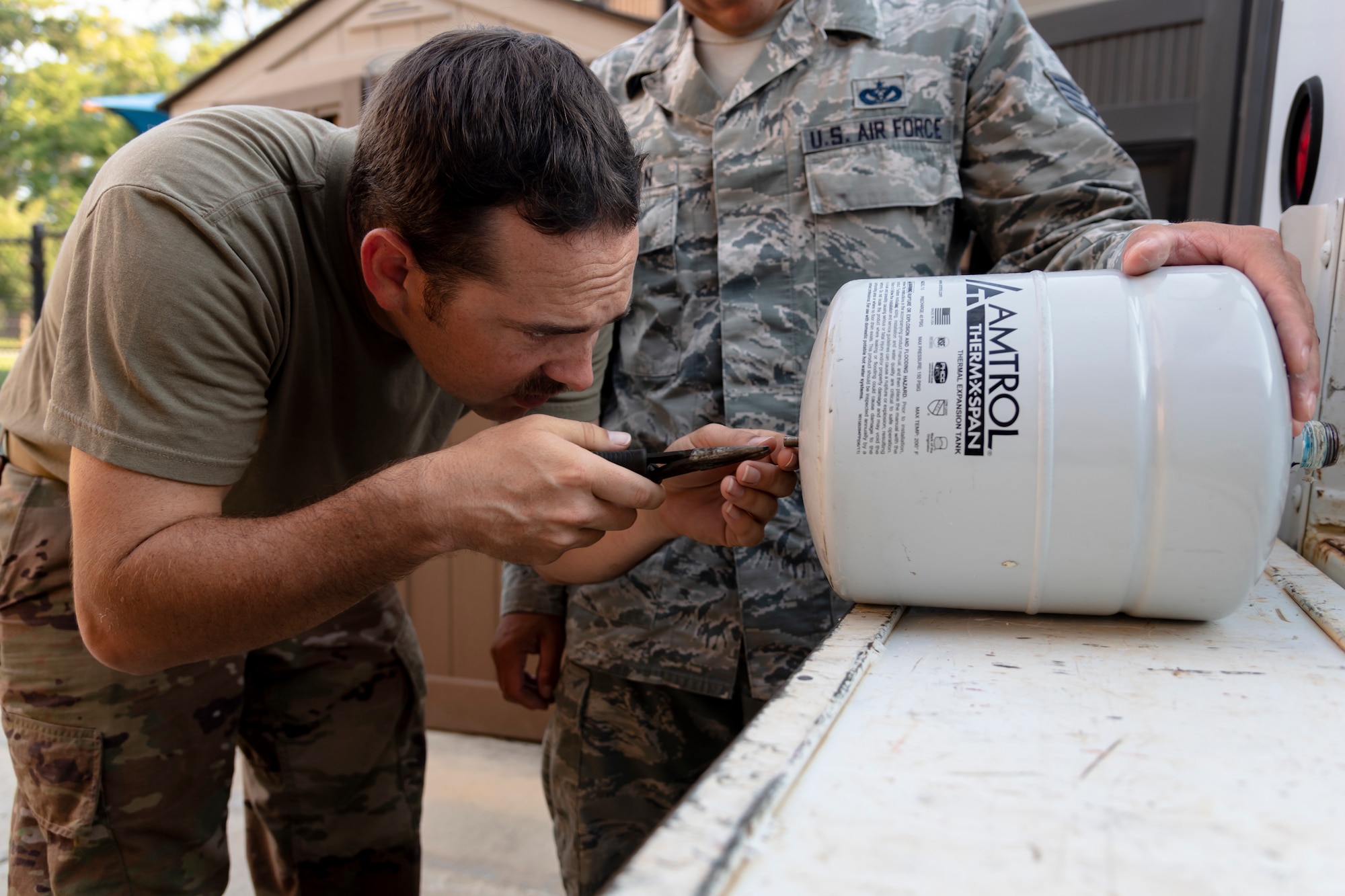 Staff Sgt. Daniel Champion, 23d Civil Engineer Squadron (CES) water and fuel systems maintenance craftsman, inspects an expansion tank, July 2, 2019, at Moody Air Force Base, Ga. Airmen from the 23d CES Water and Fuels Systems Maintenance are on-call 24/7 to sustain and maintain the base, water, sewer and gas lines and upkeep of the 696 facilities with water and fuel infrastructure. (U.S. Air Force photo by Airman 1st Class Taryn Butler)