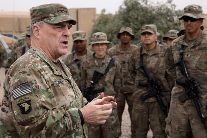 An Army officer speaks to service members.