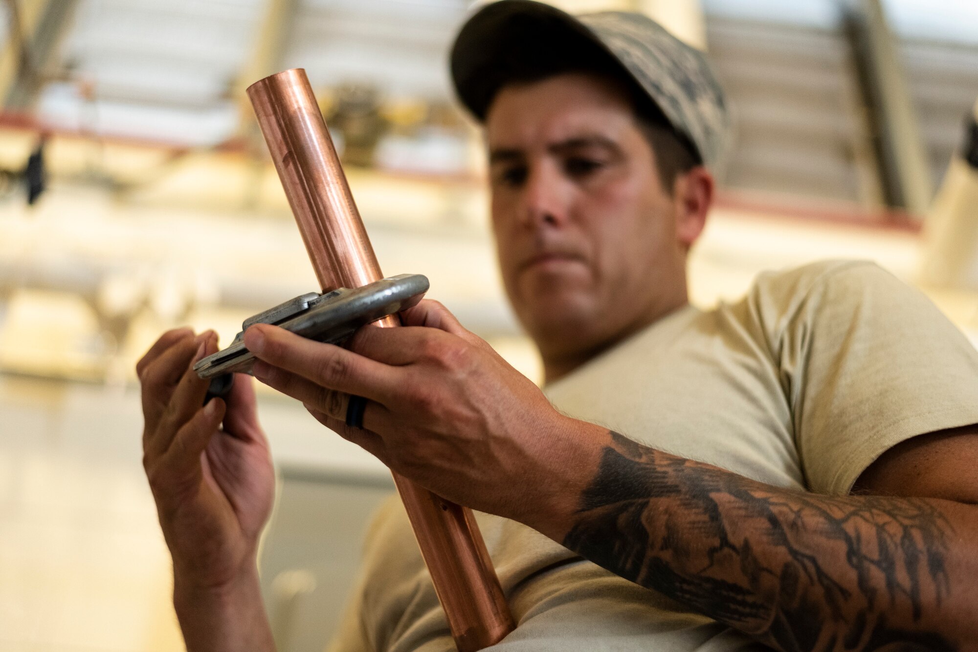 Staff Sgt. Joseph Dickerson, 23d Civil Engineer Squadron (CES) water and fuel systems maintenance craftsman, cuts a copper pipe to a fitting, July 2, 2019, at Moody Air Force Base, Ga. Airmen from the 23d CES Water and Fuels Systems Maintenance are on-call 24/7 to sustain and maintain the base, water, sewer and gas lines and upkeep of the 696 facilities with water and fuel infrastructure. (U.S. Air Force photo by Airman 1st Class Taryn Butler)