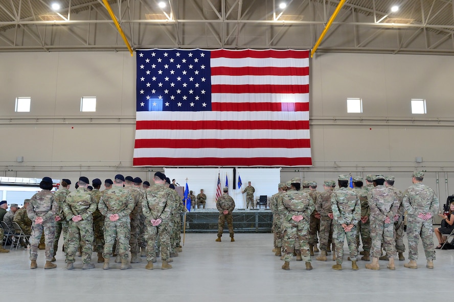 Airmen from the 799th Air Base Group stand in formation during the 432nd Mission Support Group activation ceremony at Creech Air Force Base, Nevada, July 11, 2019. During the ceremony, the 799th ABG was deactivated, and the Airmen who supported the unit were reassigned to the 432nd Mission Support Group as it activated immediately following. (U.S. Air Force photo by Senior Airman Haley Stevens)