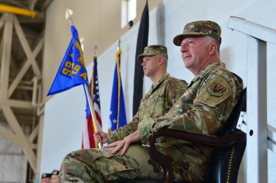 Col. Douglas, 799th Air Base Group commander, looks out at his Airmen before the 799th ABG is deactivated at Creech Air Force Base, Nevada, July 11, 2019. Directly following the 799th ABG deactivation, the 432nd Mission Support Group was stood up to provide the support functions needed for an average base. (U.S. Air Force photo by Senior Airman Haley Stevens)