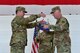 Col. Cavan Craddock, 99th Air Base Wing commander, and Col. Douglas, 799th Air Base Group commander, furls the 799th ABG guidon at Creech Air Force Base, Nevada, July 11, 2019. The 799th ABG and other Nellis units that have provided Creech necessary support services in the past were deactivated to allow the 432nd Mission Support Group and its units to activate in their place. (U.S. Air Force photo by Senior Airman Haley Stevens)