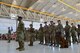 Members of the 432nd Mission Support Group listen to Col. Brian, 432nd MSG commander, as he gives opening comments to his new Airmen during the 432nd MSG activation ceremony at Creech Air Force Base, Nevada, July 11, 2019. The 799th Air Base Group began supporting Creech Airmen in 2012, but now the 432nd MSG will be taking over some of those support functions. (U.S. Air Force photo by Senior Airman Haley Stevens)