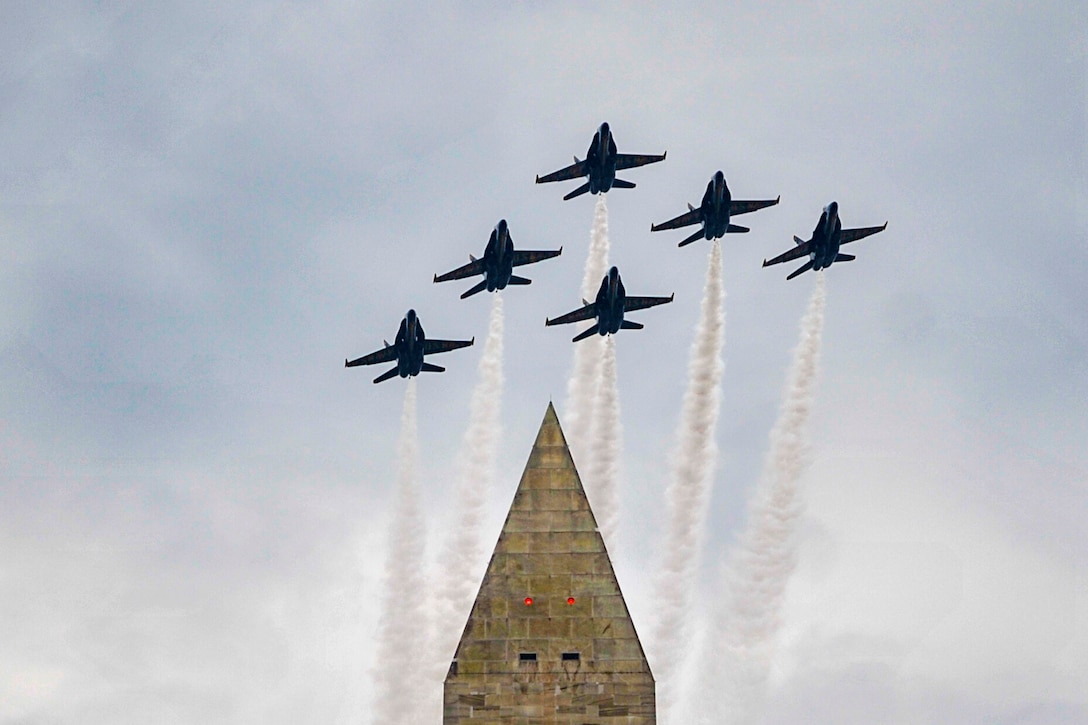 Six jets fly over the Washington Monument.