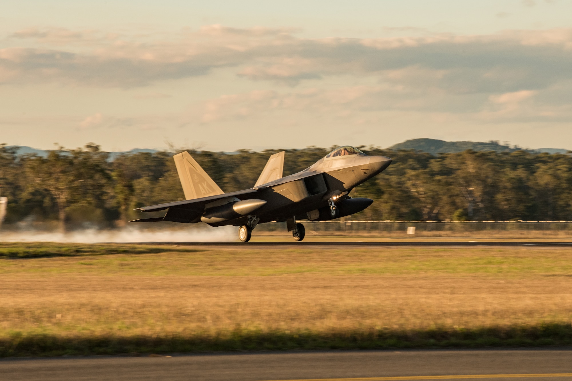 An F-22 Raptor assigned to the 90th Fighter Squadron, Joint Base Elmendorf-Richardson, Alaska, lands at Royal Australian Air Force Base Amberley for Talisman Sabre 19, July 9. The month-long exercise involves the U.S. and Australian forces, and is designed to improve combat training, readiness and interoperability. (U.S. Air Force photo by Staff Sgt. Kyle Johnson)