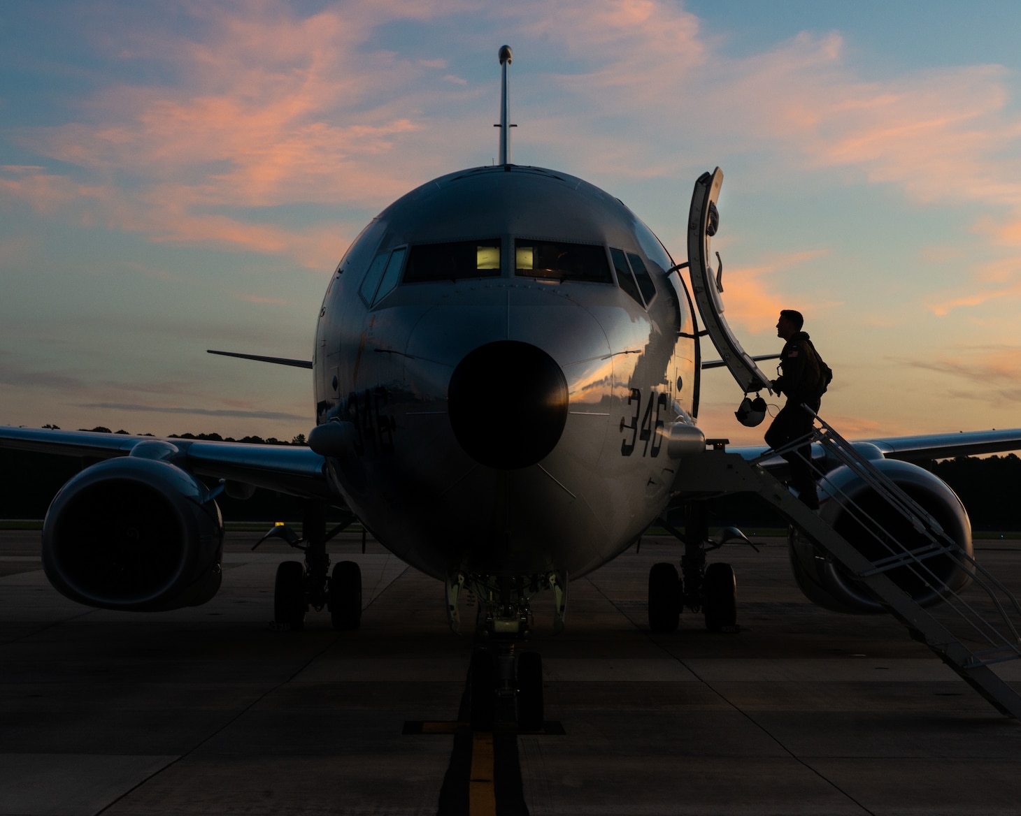 A pilot about climbing the steps of an aircraft