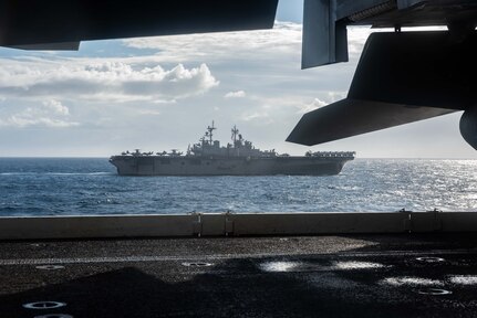CORAL SEA (July 11, 2019) Amphibious assault ship USS Wasp (LHD 1) sails alongside the forward deployed aircraft carrier USS Ronald Reagan (CVN 76), as U.S. Navy, U.S. Coast Guard, Royal Australian Navy, Royal Canadian Navy and Japan Maritime Self-Defense Force ships sail together in formation during Talisman Sabre 2019. Talisman Sabre 2019 illustrates the closeness of the Australian and U.S. alliance and the strength of the military-to-military relationship. This is the eighth iteration of this exercise.