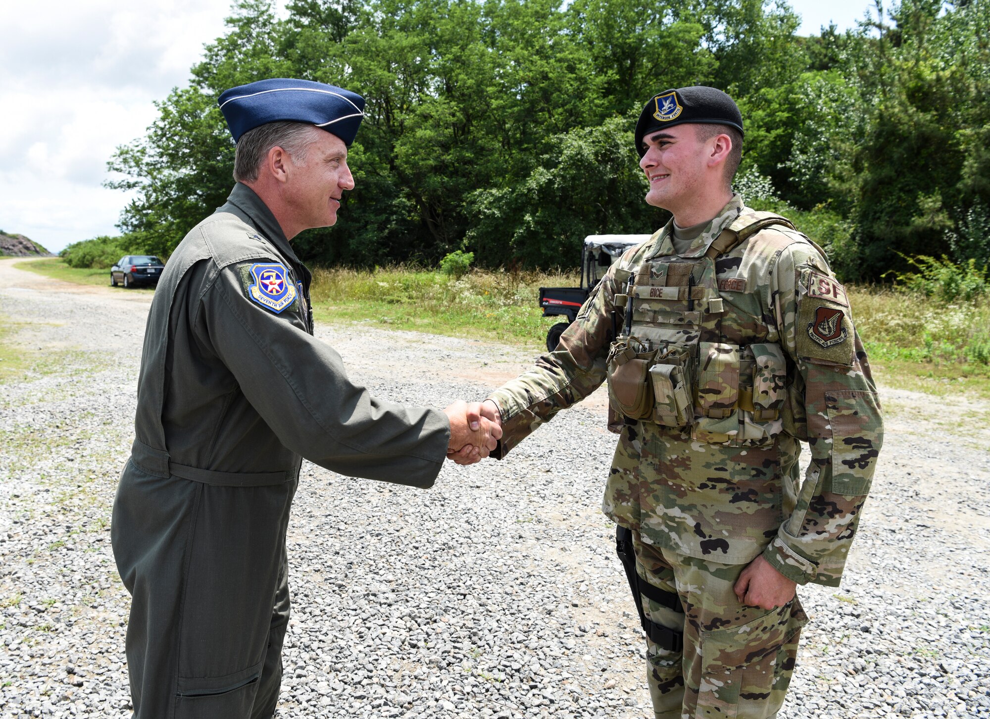 U.S. Air Force Brig. Gen. David Eaglin (left), 7th Air Force vice commander, shakes hands with Airman 1st Class Matthew Bice, 8th Security Forces Squadron member, during an immersion tour at Kunsan Air Base, Republic of Korea, July 12, 2019. Eaglin saw how the 8th SFS is ready to fulfill their critical role of defending the base. (U.S. Air Force photo by Staff Sgt. Joshua Edwards)