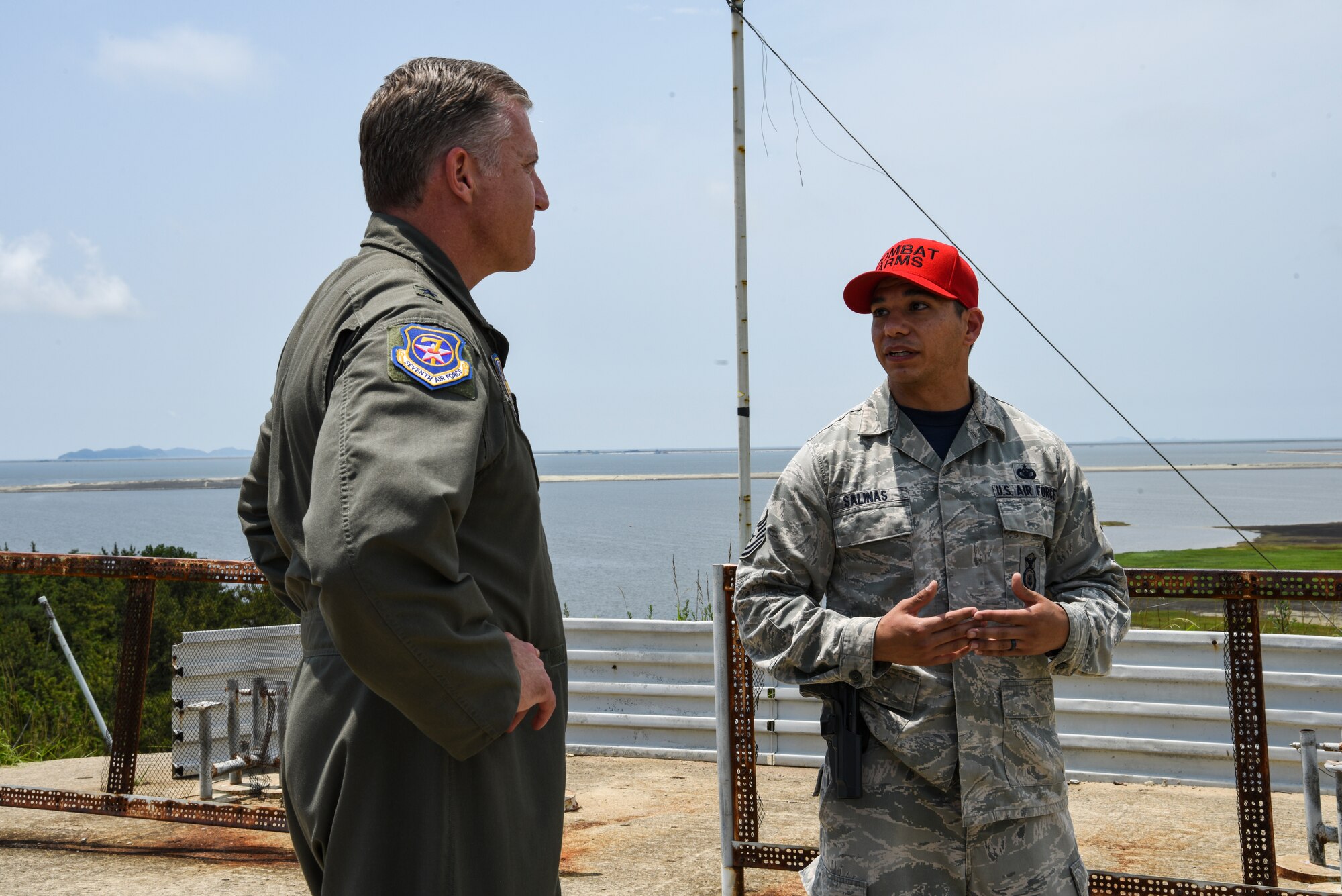 U.S. Air Force Brig. Gen. David Eaglin (left), 7th Air Force vice commander, is briefed by Tech. Sgt. Ryan Salinas, 8th Security Forces Squadron combat arms non-commissioned officer in charge, during an immersion tour at Kunsan Air Base, Republic of Korea, July 12, 2019. Eaglin had the opportunity to sample some of the weaponry the 8th SFS uses to defend the base. (U.S. Air Force photo by Staff Sgt. Joshua Edwards)