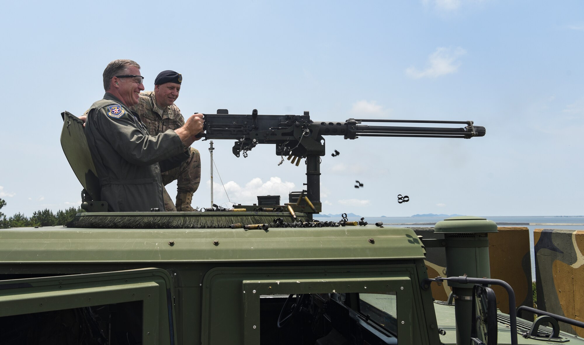 U.S. Air Force Brig. Gen. David Eaglin, 7th Air Force vice commander, fires an M2 heavy machine gun during an immersion tour at Kunsan Air Base, Republic of Korea, July 12, 2019. Eaglin had the opportunity to sample some of the weaponry the 8th SFS uses to defend the base. (U.S. Air Force photo by Staff Sgt. Joshua Edwards)