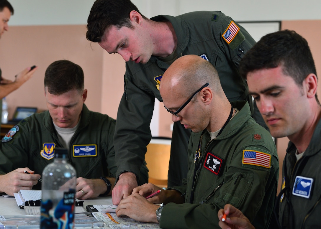 Pilots assigned to the 37th Airlift Squadron accomplish a preflight mission brief at Powidz Air Base, Poland, July 10, 2019. Members from the 86th Airlift Wing and the 37th AS exercise with the Polish air force on a quarterly basis to maintain joint readiness. (U.S. Air Force photo by Staff Sgt. Jimmie D. Pike)