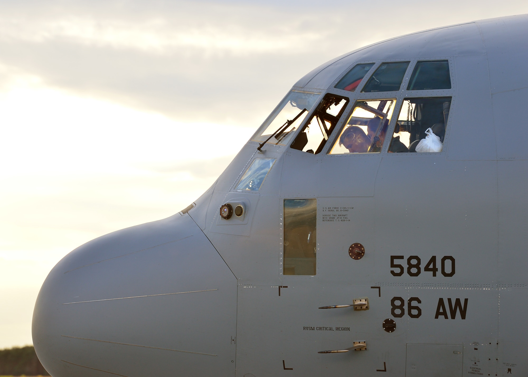 U.S. Air Force Maj. Katie Baldwin and Capt. Ashton Van Hook, 37th Airlift Squadron pilots, complete a preflight checklist before takeoff from Powidz Air Base, Poland, July 10,2019. Members from the 86th Airlift Wing and the 37th AS perform tactical airlift training with the Polish air force on a quarterly basis to assure our regional allies of our continued support. (U.S. Air Force photo by Staff Sgt. Jimmie D. Pike)