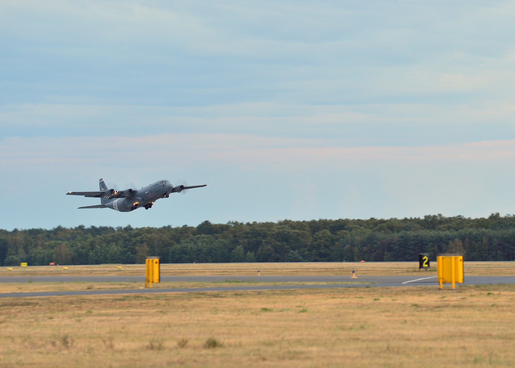 A C-130J Super Hercules assigned to the 37th Airlift Squadron takes off from Powidz Air Base, Poland, July 10, 2019. Aviation Rotation is a continuing bilateral training exercise between the U.S. and Polish air forces to increase partnership capacities. (U.S. Air Force photo by Staff Sgt. Jimmie D. Pike)