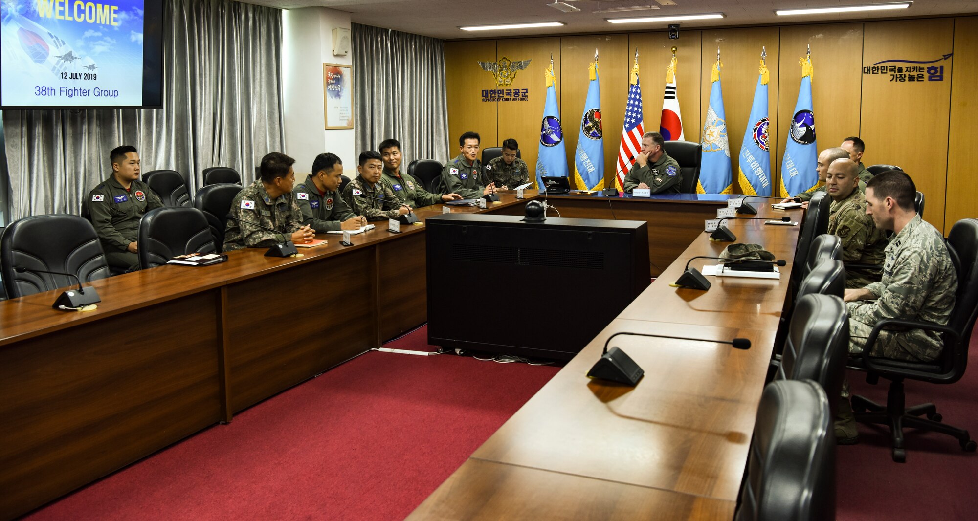 U.S. Air Force Brig. Gen. David Eaglin (center), 7th Air Force vice commander, converses with 8th Fighter Wing and 38th Fighter Group leadership at Kunsan Air Base, Republic of Korea, July 12, 2019. Eaglin visited Kunsan and Republic of Korea Air Force’s 38th FG to introduce himself and strengthen the partnership between the U.S. and ROK. (U.S. Air Force photo by Staff Sgt. Joshua Edwards)