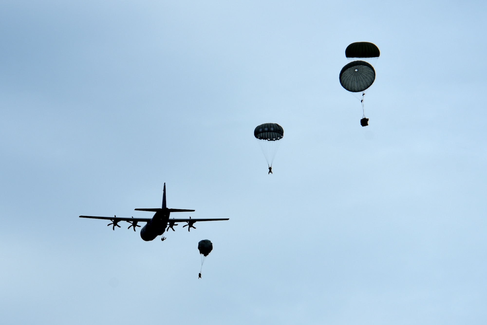 U.S. Airmen assigned to the 57th Rescue Squadron jump from a C-130J Hercules assigned to Ramstein Air Base, Germany, during over-water parachute training off the coast of Italy, July 9, 2019. Airmen assigned to the 57th RQS participated in jump training over the course of the week, both on land and over water. (U.S. Air Force photo by Staff Sgt. Kelsey Tucker)