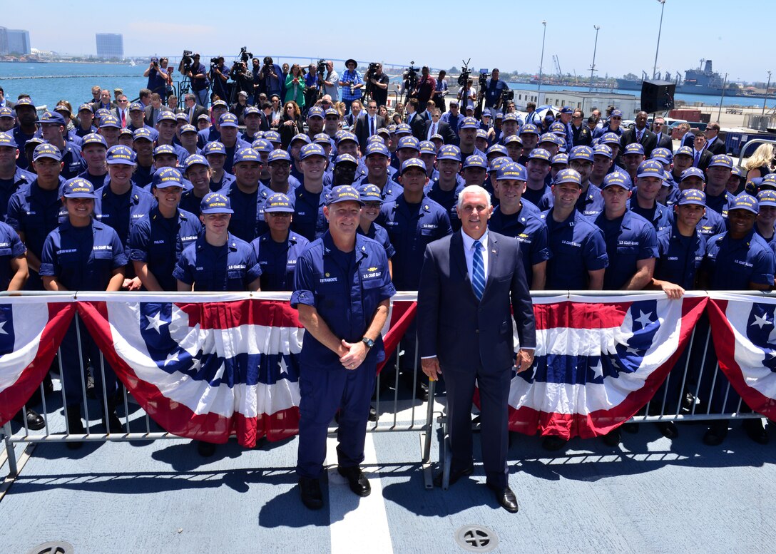 Vice President Mike Pence stands with U.S. Coast Guard members.