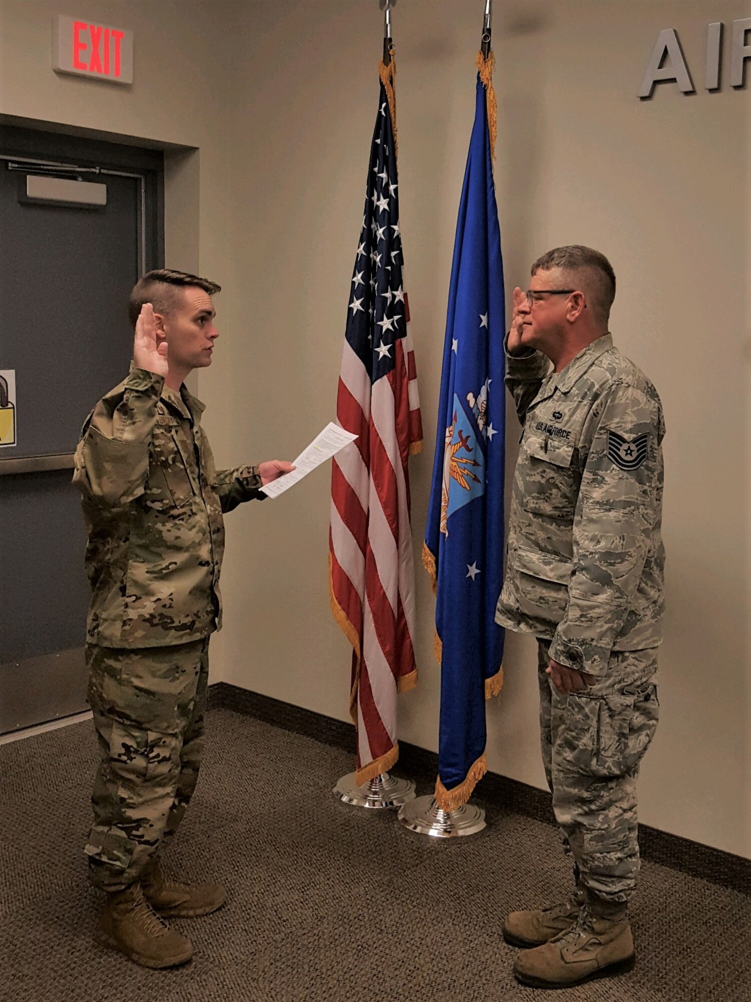 Maj. Ben Hulsey, 913th Force Support Squadron commander, facilitates the oath of enlistment to Tech. Sgt. Raymond Jauch, 96th Aerial Port Squadron air transportation specialist, on March 11, 2019 at Little Rock Air Force Base, Ark.  Jauch will retire this year with more that 28 years of active and reserve military service. (Courtesy photo)