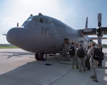 Airmen assigned to the 115th Fighter Wing, Madison, Wisconsin, board an Illinois Air National Guard C-130 Hercules for transport to New York July 9, 2019, for the Greater Chenango Cares and Healthy Cortland Innovative Readiness Training.