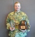 Sgt. 1st Class Brian Stoa, USAR Operations NCOIC for the Oklahoma City Recruiting Battalion and a champion shotgun shooter, poses with three of the trophies he’s already won in past three months.