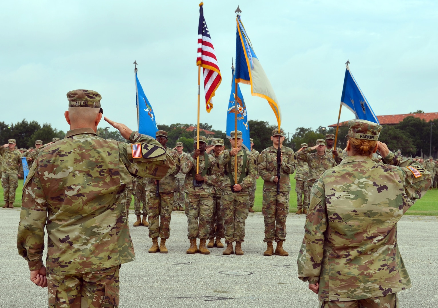 Col. Daniel Allen (left), 470th Military Intelligence Brigade incoming commander, and Col. Ingrid Parker (right), 470th MI Brigade outgoing commander, salute the colors during the brigade’s change of command ceremony at the MacArthur Parade Field at Joint Base San Antonio-Fort Sam Houston July 9.