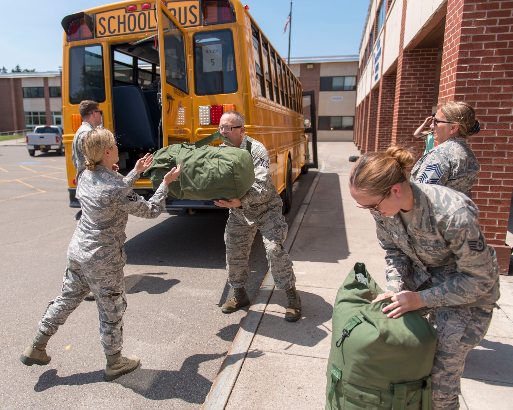 Airmen assigned to the 115th Fighter Wing, Madison, Wisconsin, arrive at Cortland High School New York July 9, 2019, for the Greater Chenango Cares and Healthy Cortland Innovative Readiness Training. The IRT mission is comprised of Active Duty Air Force, Army, Navy, Reserves and National Guard troops working alongside our local community partners to bring health care and veterinary services to the underserved communities of Cortland and Chenango counties. (U.S. Air National Guard photo by Airman 1st Class Cameron Lewis)