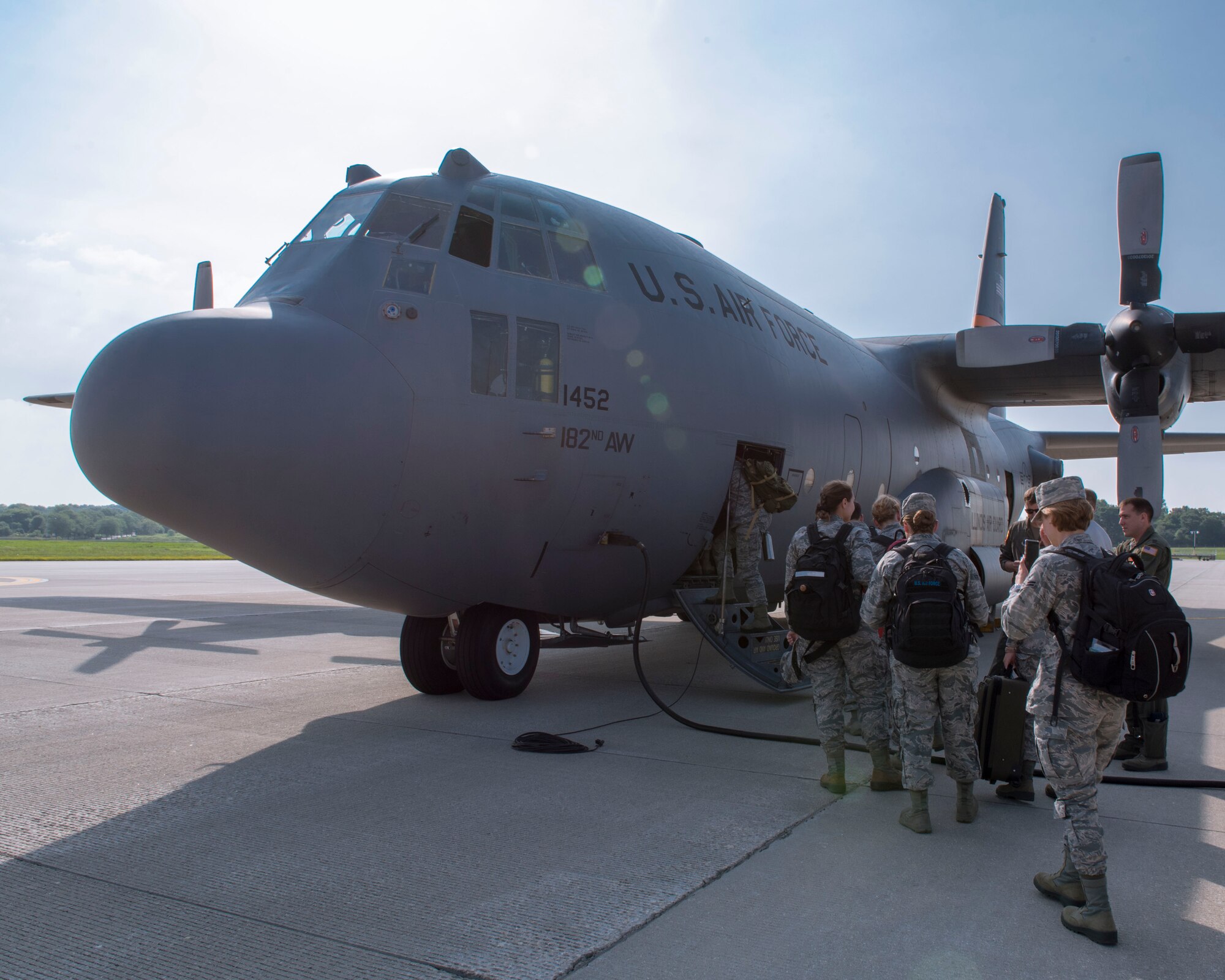 Airmen assigned to the 115th Fighter Wing, Madison, Wisconsin, board an Illinois Air National Guard C-130 Hercules for transport to New York July 9, 2019, for the Greater Chenango Cares and Healthy Cortland Innovative Readiness Training. The IRT mission is comprised of Active Duty Air Force, Army, Navy, Reserves and National Guard troops working alongside our local community partners to bring health care and veterinary services to the underserved communities of Cortland and Chenango counties. (U.S. Air National Guard photo by Airman 1st Class Cameron Lewis)