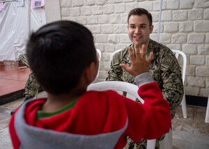 A doctor speaks to a patient.