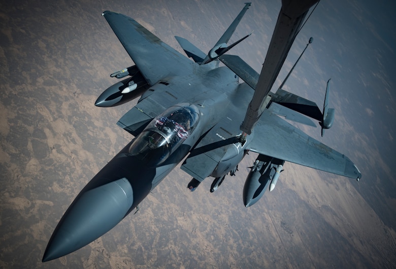 An F-15E Strike Eagle conducts aerial refueling with a KC-10