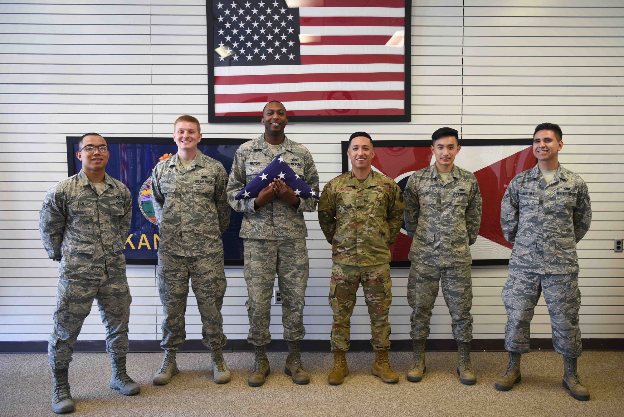 Members of the McConnell Air Force Base Honor Guard pose for a photo July 9, 2019, at McConnell Air Force Base, Kan. McConnell’s Honor Guard practices presenting the colors, folding the flag and executing flag duty so they are prepared to perform at all types of events on and off base. (U.S. Air Force photo by Airman 1st Class Alexi Myrick)