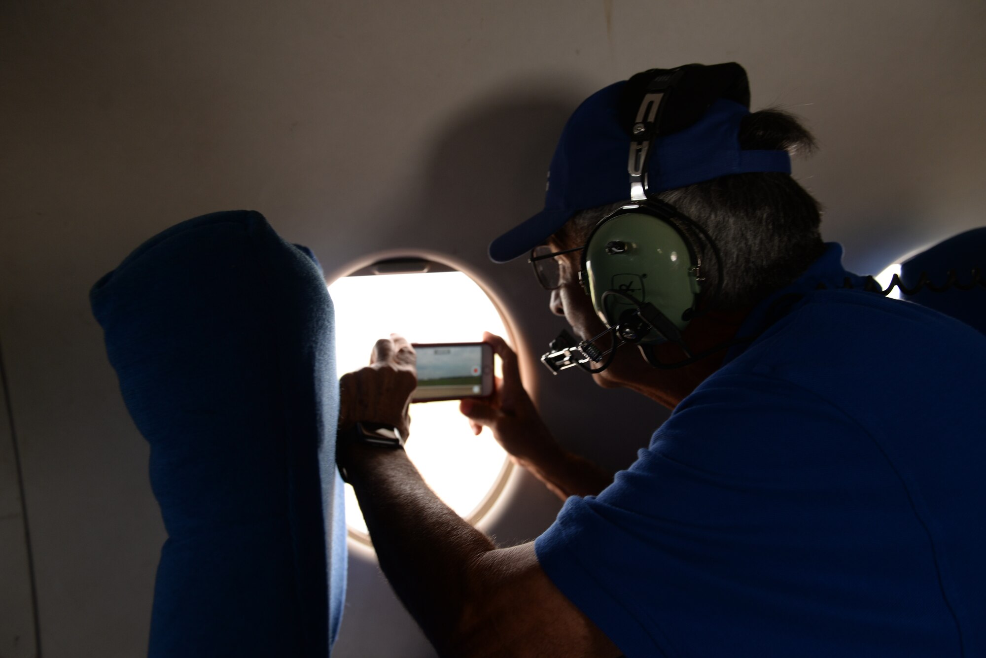 Robert Lacey, takes a photo during a T-1A Jayhawk flight Jul 3, 2019, in Columbus Air Force Base, Miss. airspace. Two Undergraduate Pilot Training 71-01 class members, retired Cols. James Donnelly and Robert Lacey, were able to fly in a T-1A with the 48th Flying Training Squadron during their UPT class’s 50th anniversary. (U.S. Air Force photo by Airman 1st Class Hannah Bean)